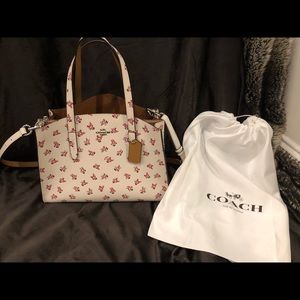 Coach Charlie carryall with floral bloom